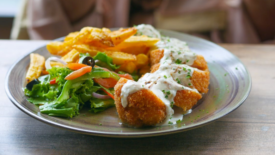 chicken cordon bleu on plate with salad