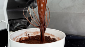 chocolate batter in a bowl on a stand mixer