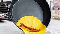 egg sliding out of nonstick pan.png egg sliding out of nonstick pan