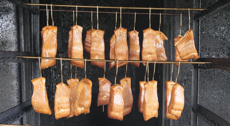 fish filets in a smoker