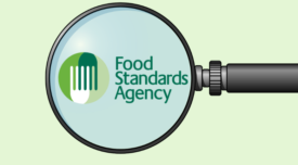 food standards agency logo under a magnifying glass