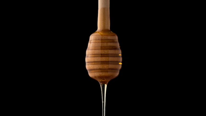 honey dripping from a wand