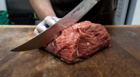 hunk of beef being sliced