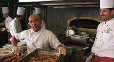 kitchen staff man looking at camera