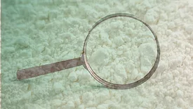 magnifying glass and white powder