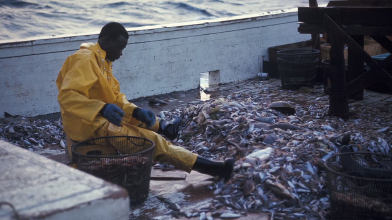 man on commercial fishing boat.png