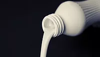 milk pouring out of bottle