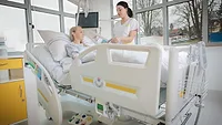 nurse caring for patient.png nurse caring for a patient in a hospital