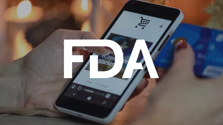 person using a smartphone to make a purchase with an FDA logo overlay