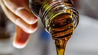 pouring oil out of jar