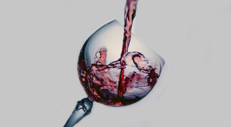 red wine being poured into a glass