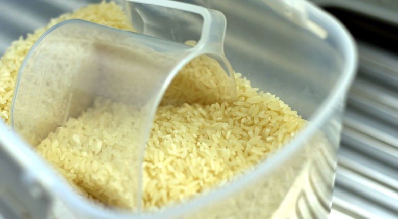 rice in a container with a clear scoop