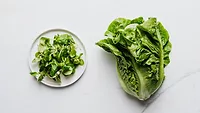 romaine whole and chopped on plate.png romaine lettuce, whole and chopped on a plate