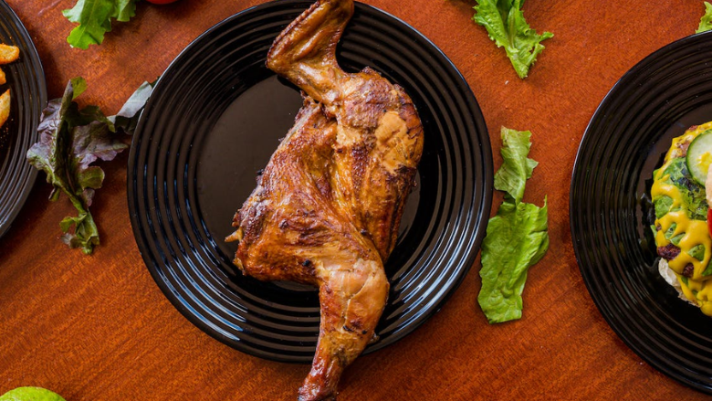 rotisserie chicken leg on plate.png