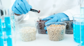 scientist holding different food ingredients in lab setting