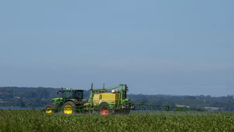 tractor spraying pesticides