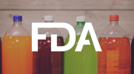 unlabeled 2L bottles of colorful soda with FDA logo overlay