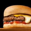 cheeseburger up close black background