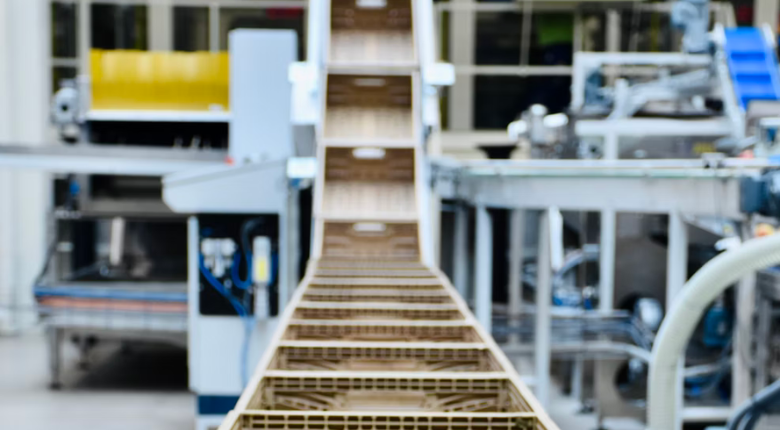 crates on a conveyor belt in a processing factory