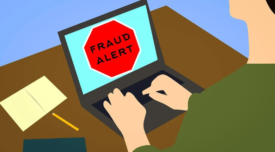 illustration of someone using a laptop that says fraud alert