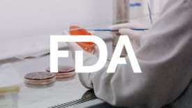 lab tech culturing bacteria fda logo overlay