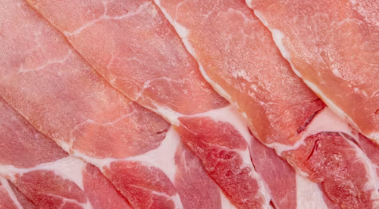 raw bacon strips up close