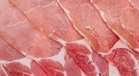 raw bacon strips up close raw bacon strips up close