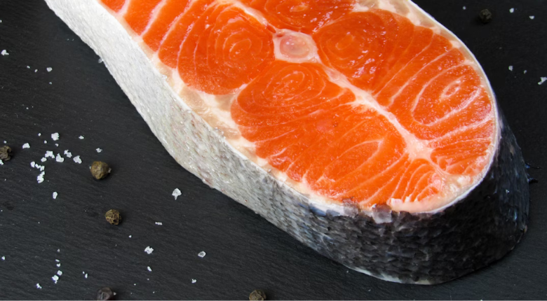 raw thick cut of salmon with skin on