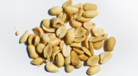 shelled salted peanuts whitre background