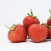 small pile of strawberries white background