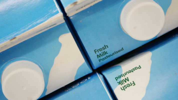 top-down image of milk cartons that say fresh milk pasteurized