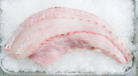 white fish filet on ice