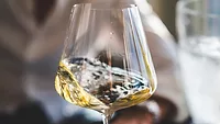 white wine swirling in glass