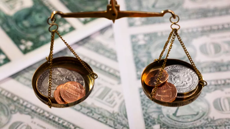 U.S. currency on scale