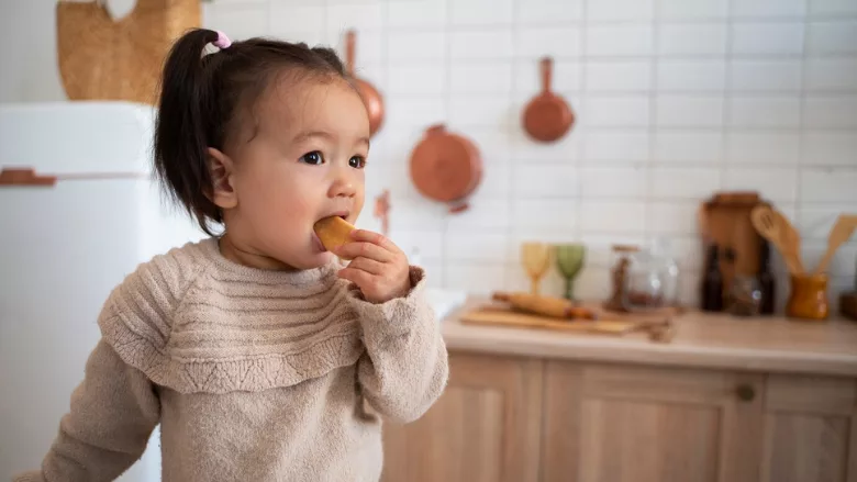 a toddler eating