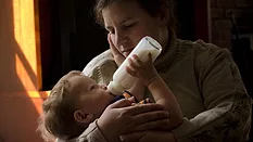 baby eating bottle