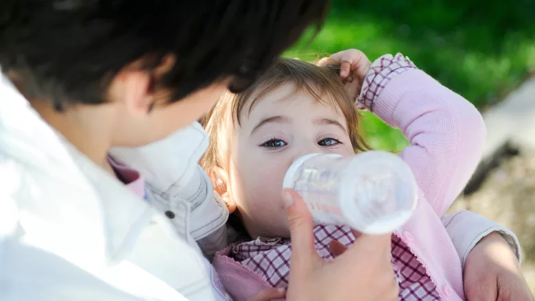 baby eating bottle