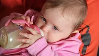 baby eating bottle