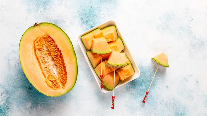 cantaloupe half and cut pieces.png cantaloupe