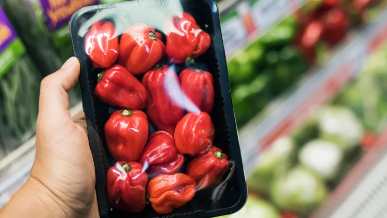 fresh peppers in plastic packaging