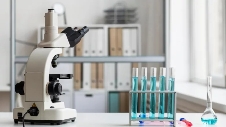 microscope and glassware in laboratory