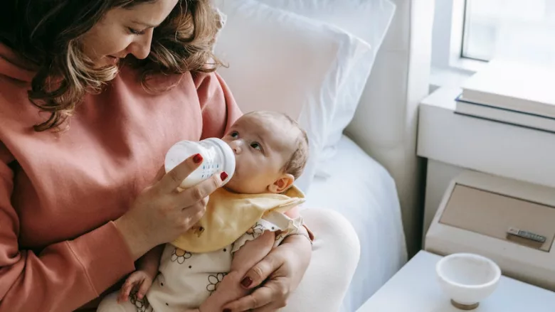baby eating bottle