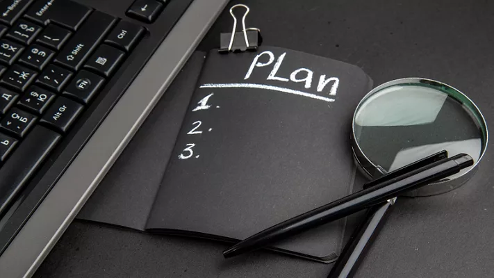 notebook that says plan