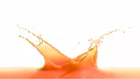 orange-ish pinkish juice splash