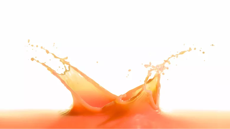 orange-ish pinkish juice splash