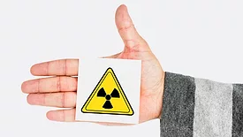 radioactivity symbol on person's hand