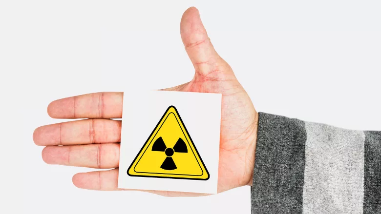 radioactivity symbol on person's hand