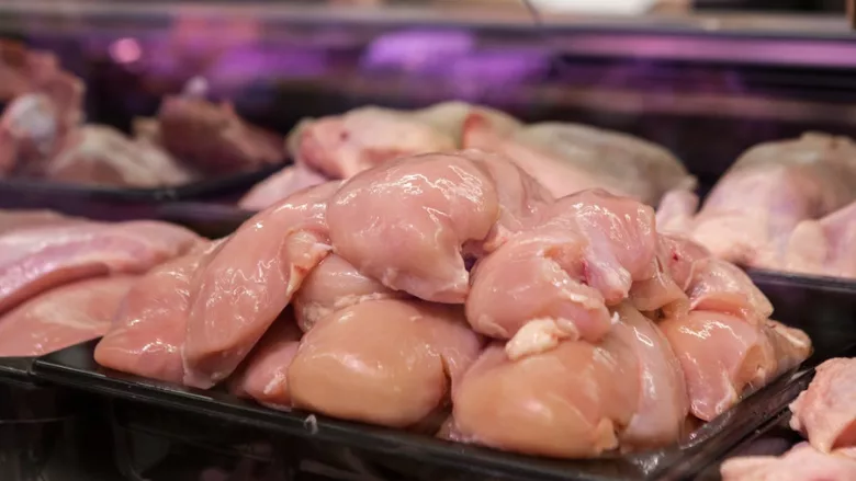 raw chicken breast on display at store