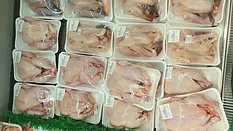 raw chicken on display at supermarket raw chicken on display at supermarket