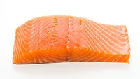 raw salmon filet white background